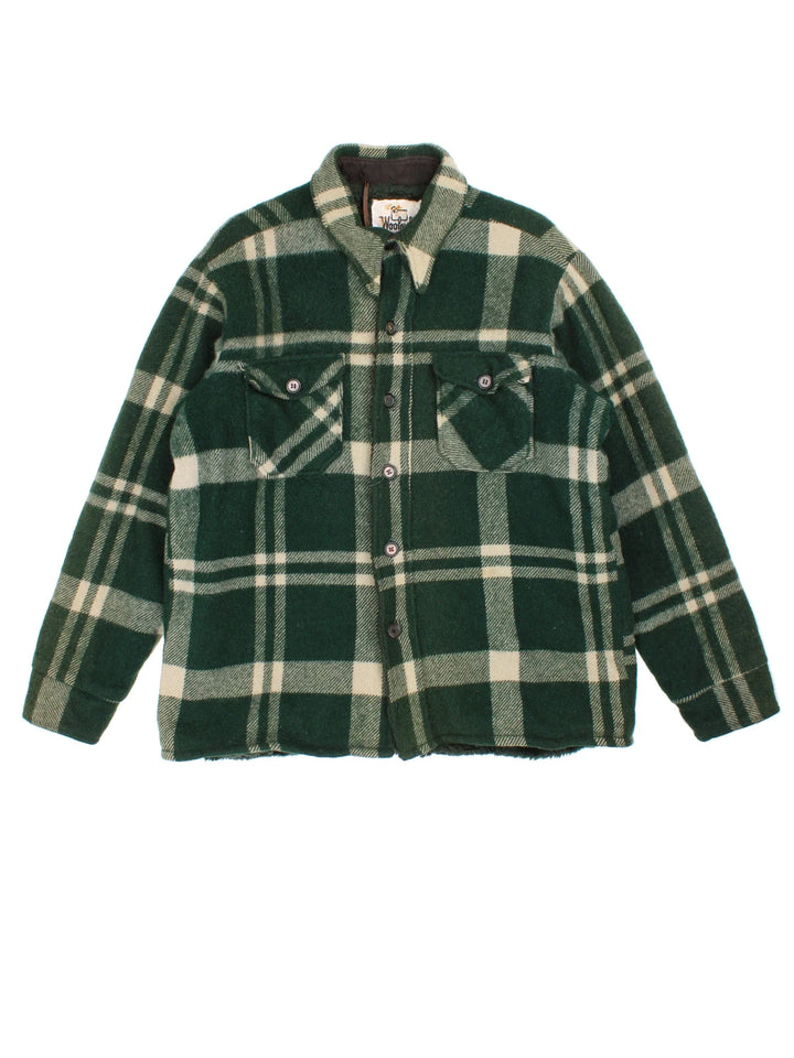 Woolrich CPO Jacket in a green colourway. Button fastening, with front pockets and fleece lining.
