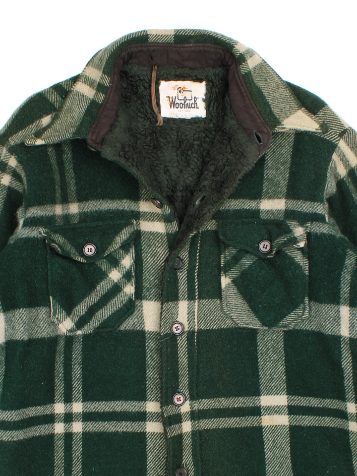 Woolrich CPO Jacket in a green colourway. Button fastening, with front pockets and fleece lining.