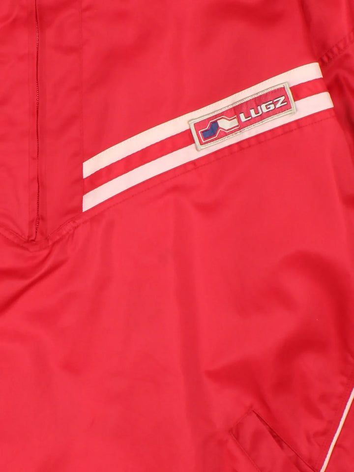 Vintage Lugz Shell Suit Jacket & Pants Set in a red colourway. Jacket has half zip up closure, side pockets, and the logo embroidered on the front and larger on the back. Pants have an elasticated waist with drawstring, pockets, mesh lining and the logo embroidered on the front and back