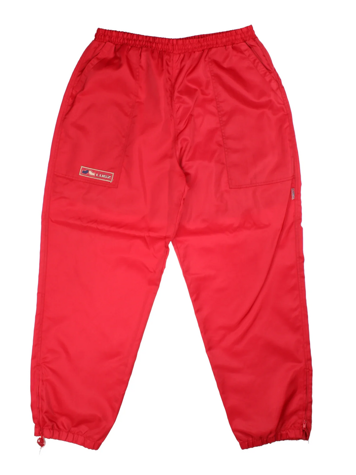 Vintage Lugz Shell Suit Jacket & Pants Set in a red colourway. Jacket has half zip up closure, side pockets, and the logo embroidered on the front and larger on the back. Pants have an elasticated waist with drawstring, pockets, mesh lining and the logo embroidered on the front and back