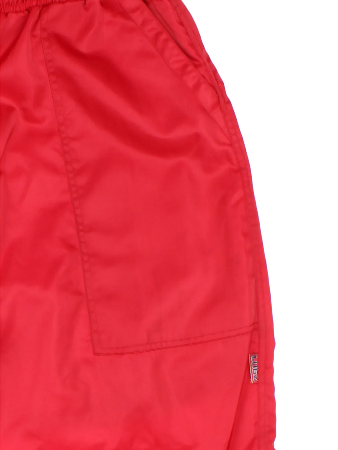 Vintage Lugz Shell Suit Jacket & Pants Set in a red colourway. Jacket has half zip up closure, side pockets, and the logo embroidered on the front and larger on the back. Pants have an elasticated waist with drawstring, pockets, mesh lining and the logo embroidered on the front and back