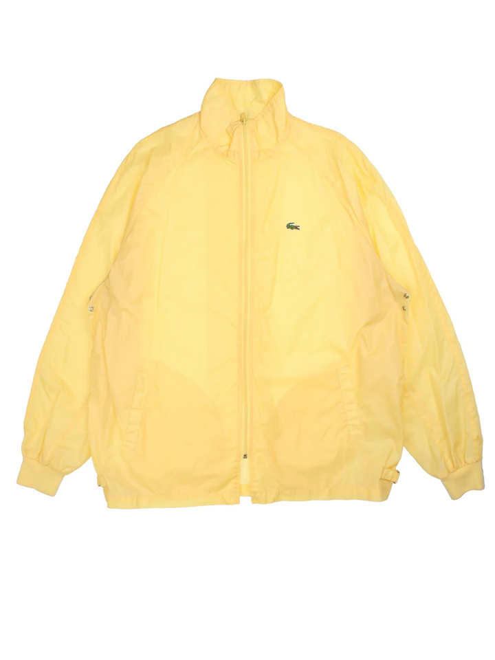 Vintage The Lacoste Club Nylon Jacket in a yellow colourway. Zip up closure, has side pockets, and the logo embroidered on the front.