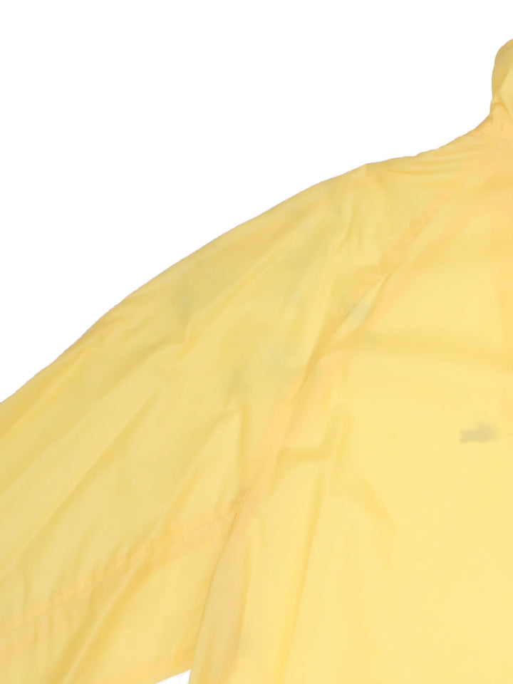 Vintage The Lacoste Club Nylon Jacket in a yellow colourway. Zip up closure, has side pockets, and the logo embroidered on the front.