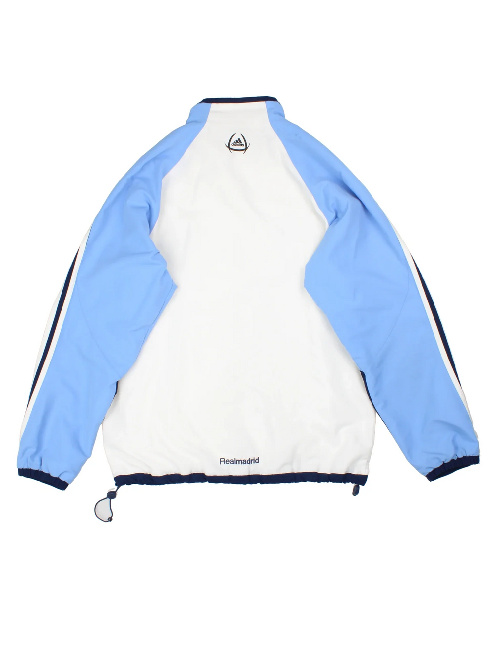 2005/06 Real Madrid Adidas Tracksuit Jacket in a white and blue colourway. Zip up closure, has side pockets, iconic three stripes detailing down the sleeves, and has the logos embroidered on the front/back.