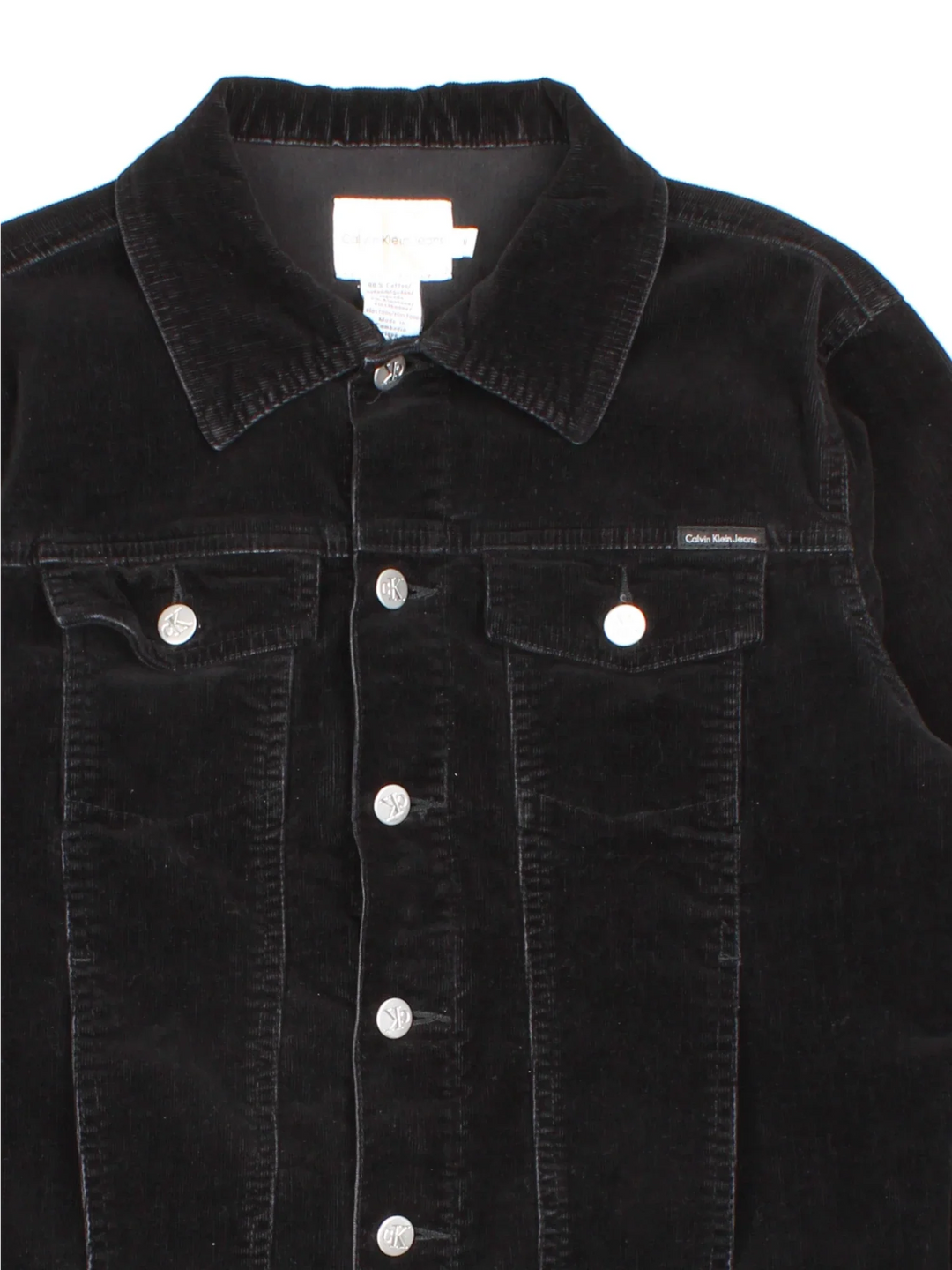 Calvin Klein Corduroy Jacket in a black colourway. Buttons up and has multiple pockets, and the logo tab embroidered on the front.