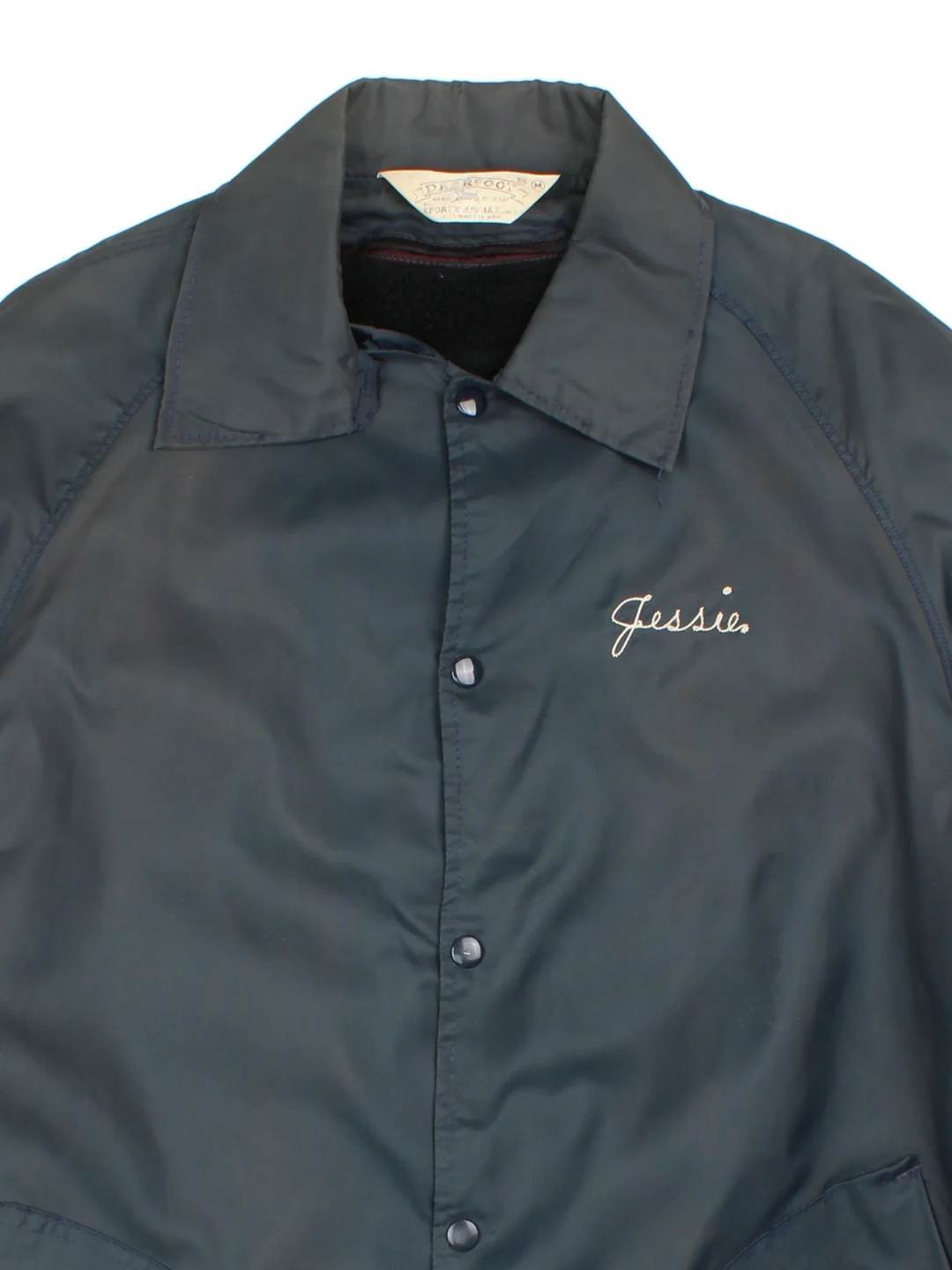 Vintage 1980's Fire Fighter Coach Jacket in a navy blue colourway. Zips up and has side pockets, detachable insulated fleece lining, and the logo embroidered on the back.