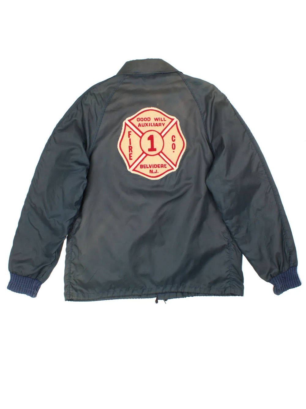 Vintage 1980's Fire Fighter Coach Jacket in a navy blue colourway. Zips up and has side pockets, detachable insulated fleece lining, and the logo embroidered on the back.