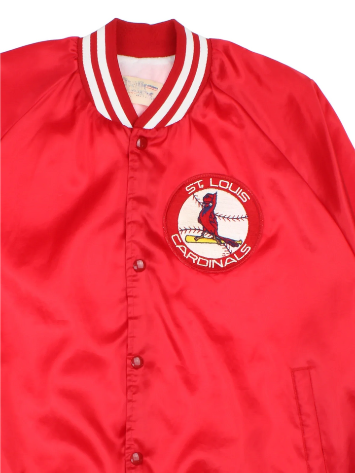 90's St Louis Cardinals MLB Chalk Line Varsity Jacket in a red colourway. Buttons up and has side pockets, and the team logo embroidered on the front.