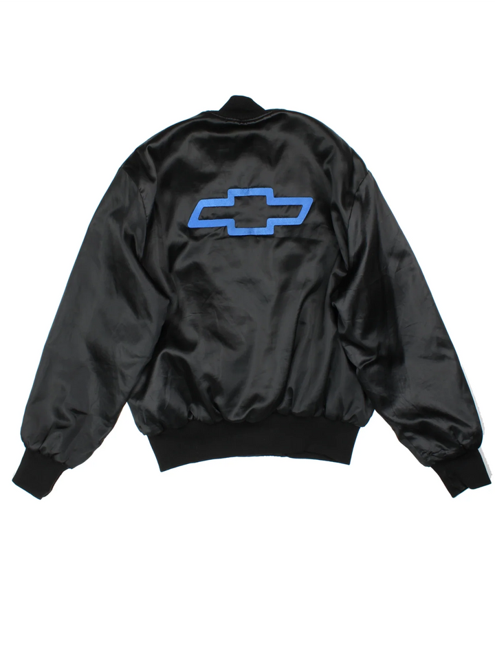 Vintage 90's Chevrolet Varsity Jacket in a black colourway. Zips up and has side pockets, and the logo embroidered on the front/back.