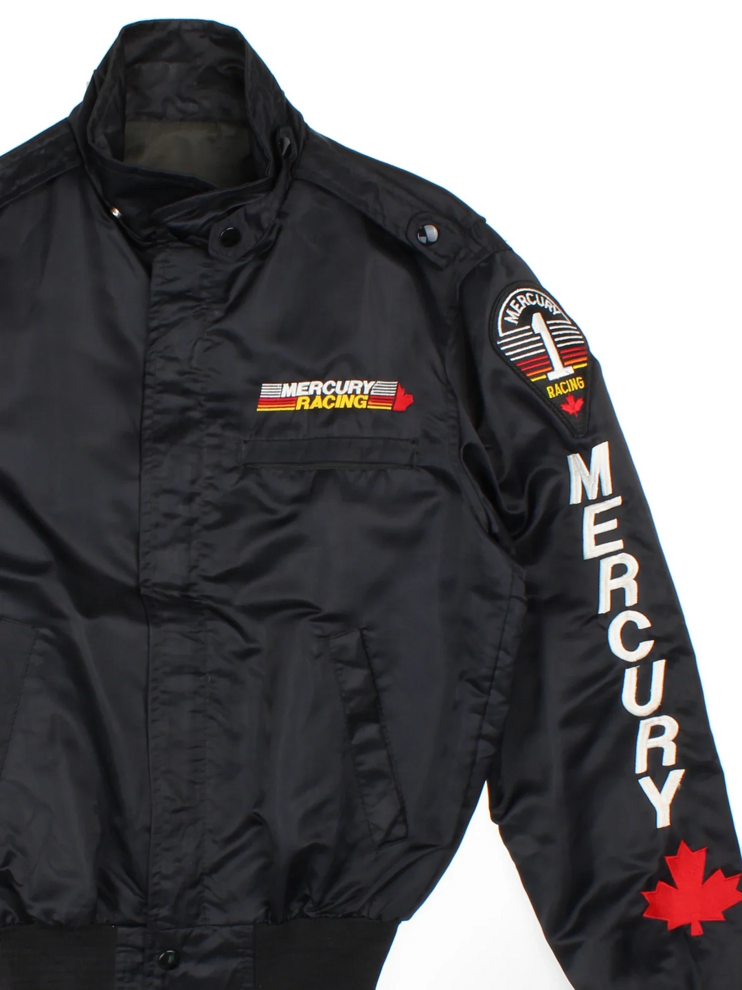 Mercury Racing Nascar Jacket in a black colourway. Zips up and has multiple pockets, and the logo / spell out embroidered on the front and sleeves.