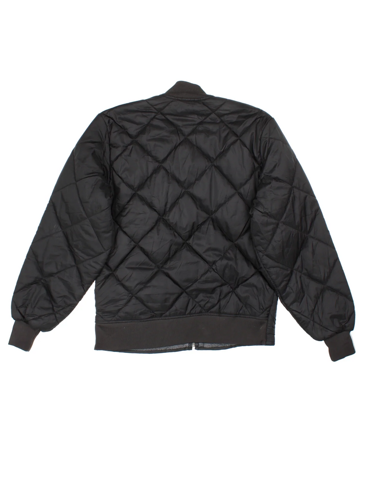 Dickies Quilted Jacket in a black colourway. Zip up fastening, side pockets and jersey lined.