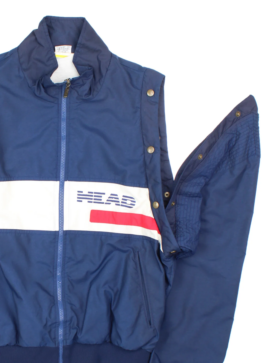 Vintage 80's Head Jacket/Gilet in a blue colourway. Zips up and has side pockets, elasticated collar/cuffs, button popper removable sleeve and embroidered branding on the front.