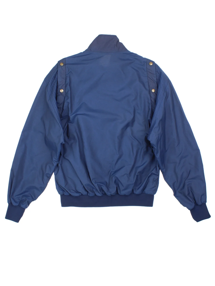 Vintage 80's Head Jacket/Gilet in a blue colourway. Zips up and has side pockets, elasticated collar/cuffs, button popper removable sleeve and embroidered branding on the front.