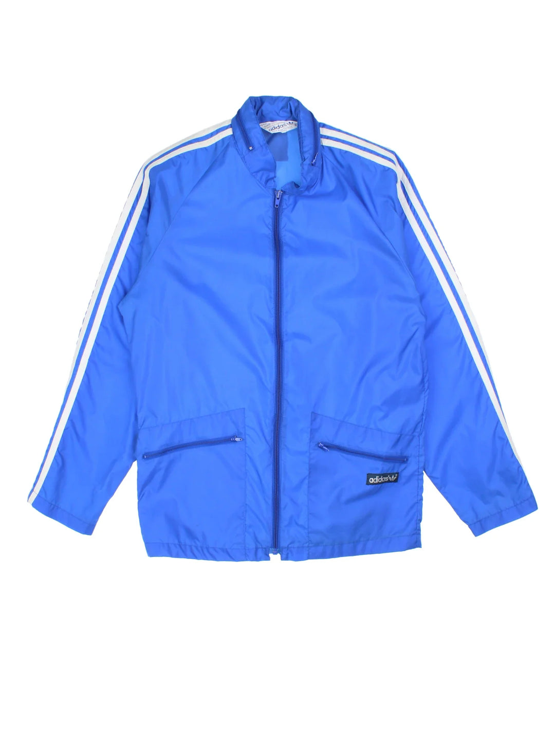 70's Adidas Windbreaker Jacket in a blue colourway. Zips up and has side pockets, and has the logo embroidered on the front.