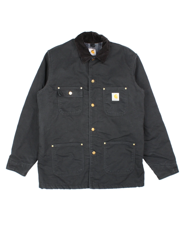Carhartt Chore Jacket in a black colourway. Buttons up and has multiple pockets, and has the logo embroidered on the front.