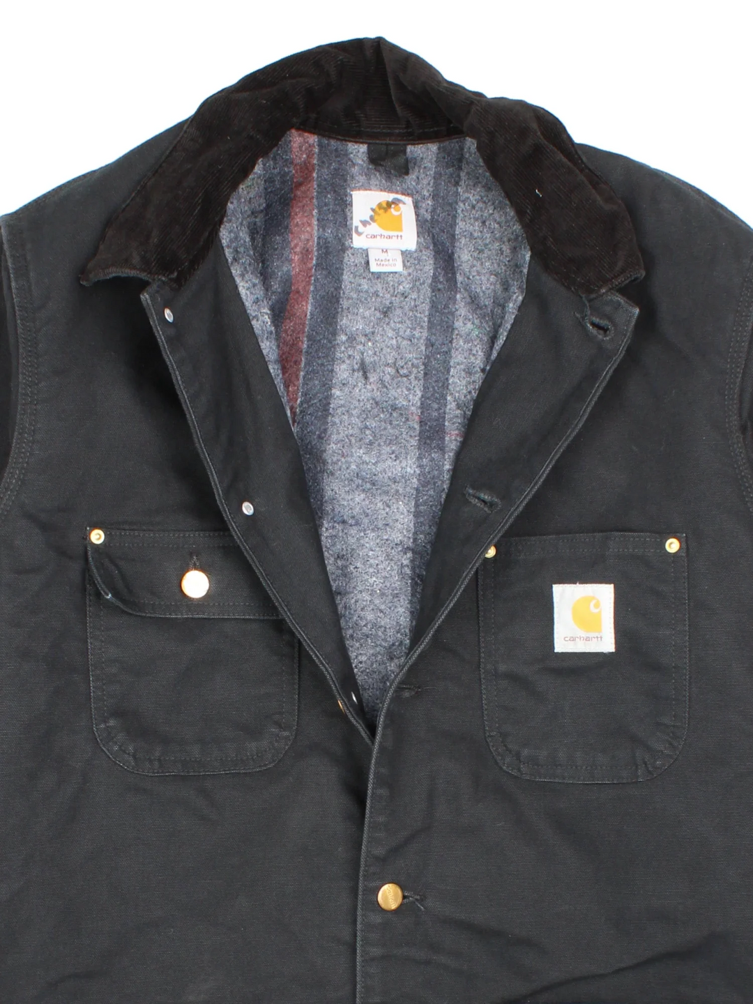 Carhartt Chore Jacket in a black colourway. Buttons up and has multiple pockets, and has the logo embroidered on the front.