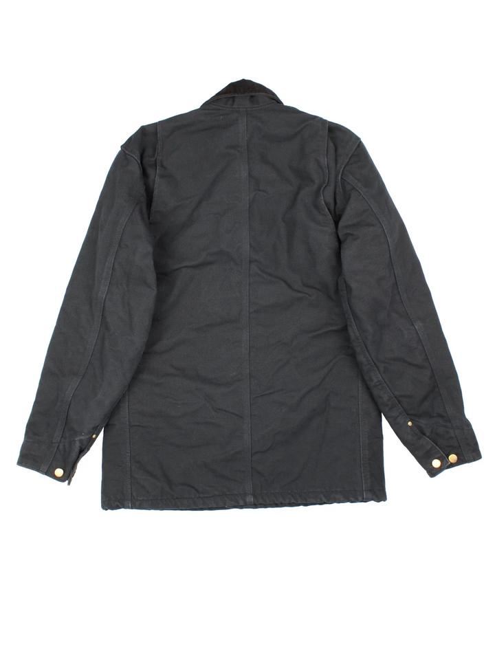 Carhartt Chore Jacket in a black colourway. Buttons up and has multiple pockets, and has the logo embroidered on the front.