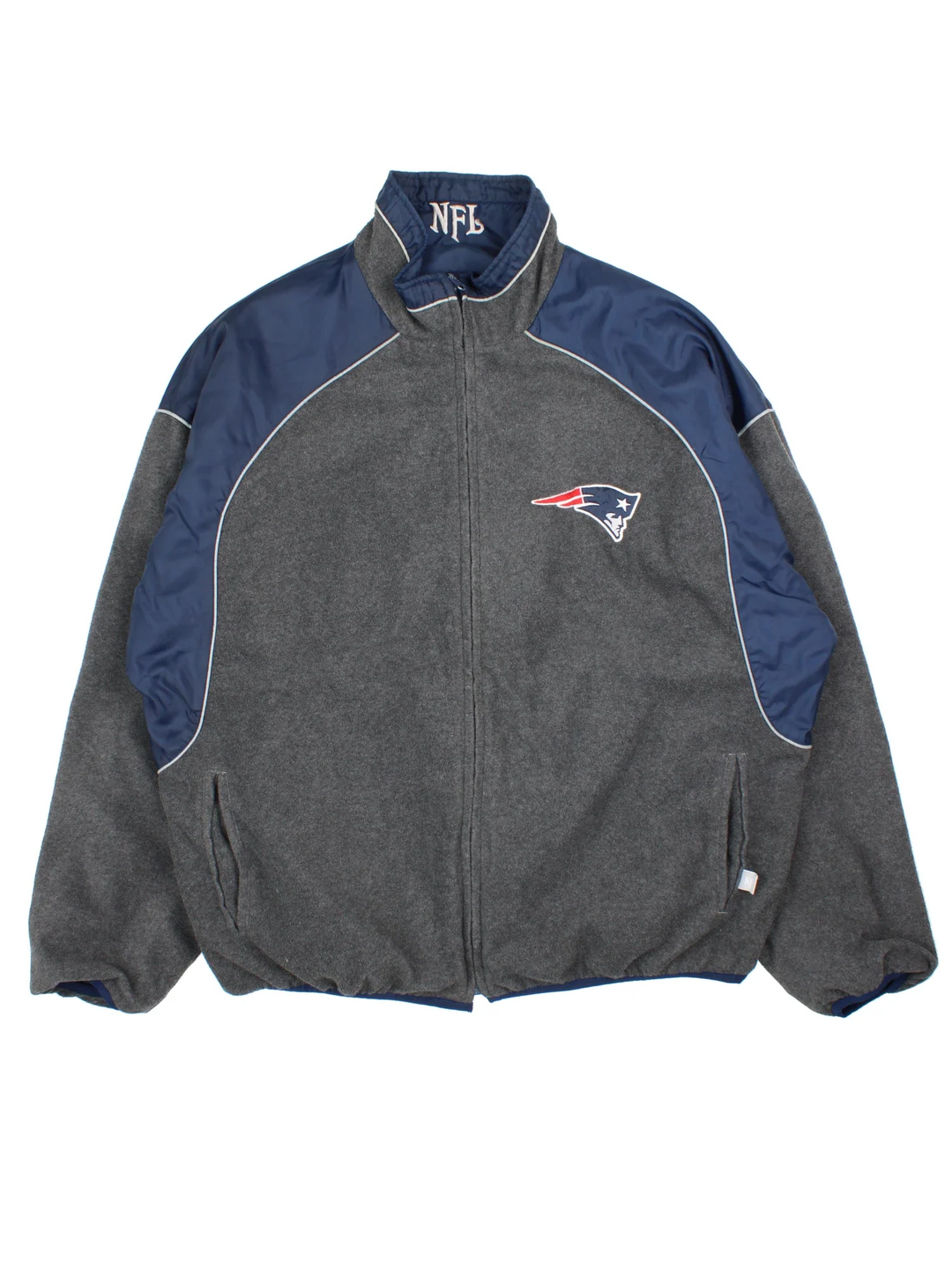 New England Patriots NFL Reversible Jacket in either a blue jacket colourway or grey fleece option. Zips up and has side pockets, and has the team logo embroidered on the front and back.