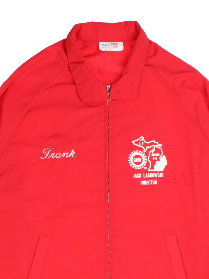 Vintage UAW College Bomber Jacket in a red colourway. Full zip with two front pockets, button cuffs and two small logos on the front