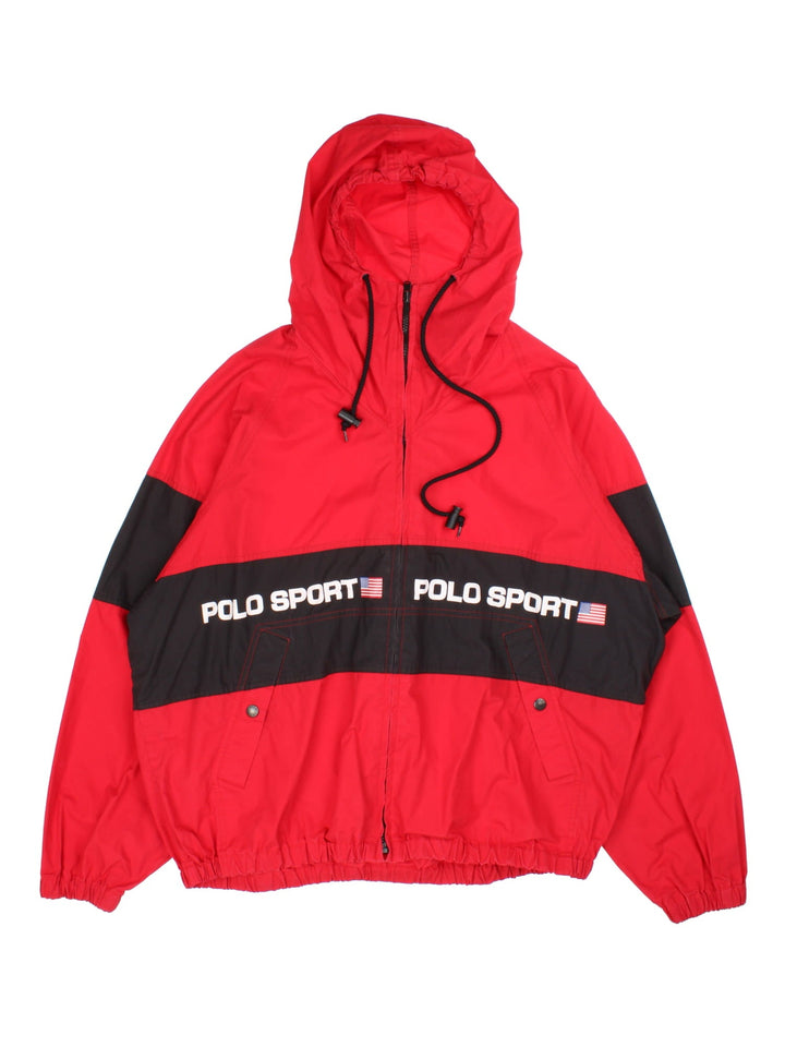 Ralph Lauren Polo Sport Jacket in a red colourway with black panelling. Full zip with drawstring hood and button pockets on the front. Polo Sport logo wrapped around.