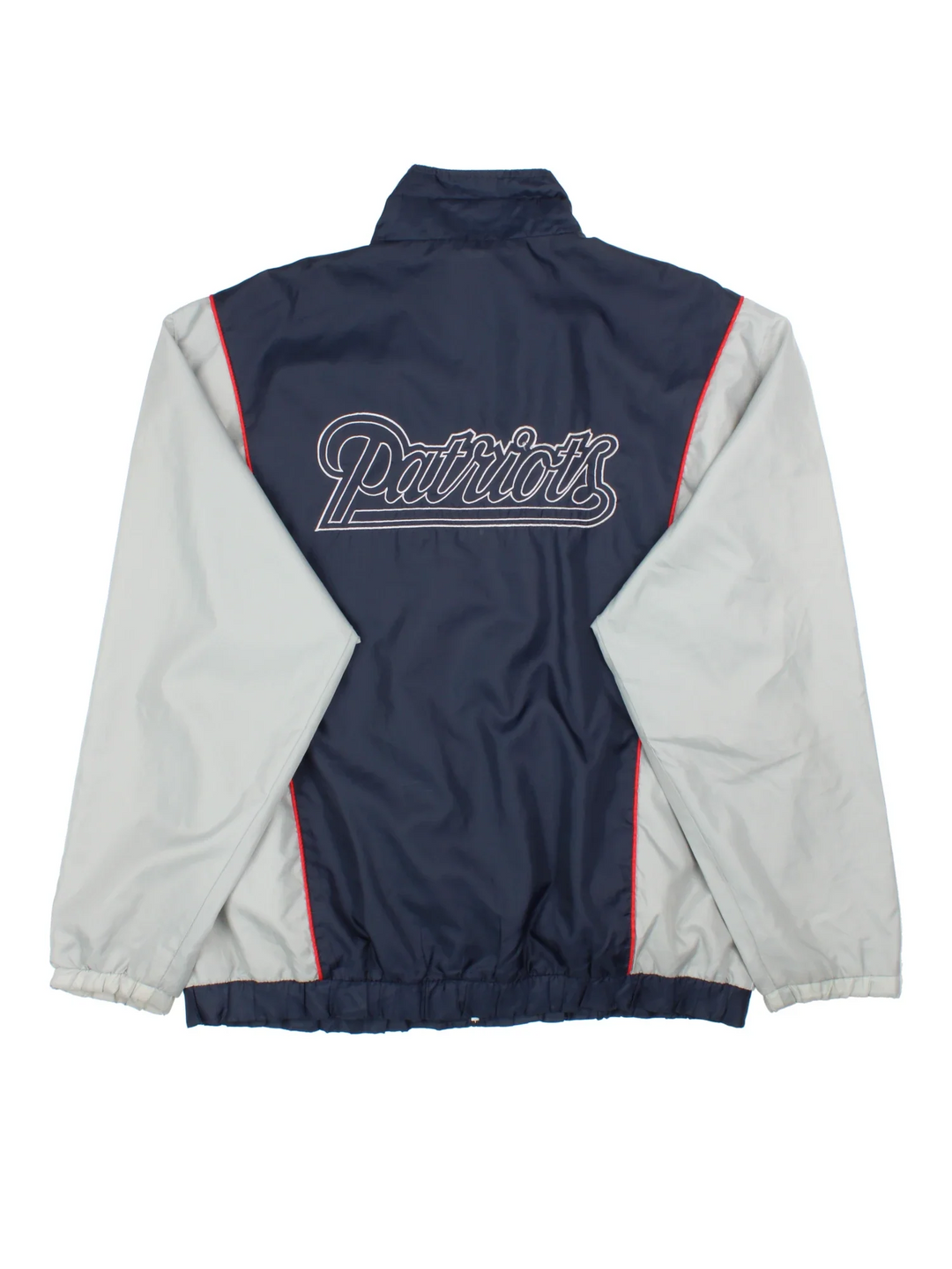 New England Patriots NFL Windbreaker Jacket in a blue colourway with grey panelling. Full zip up, multiple pockets, small logo on the front and large text logo across the back.
