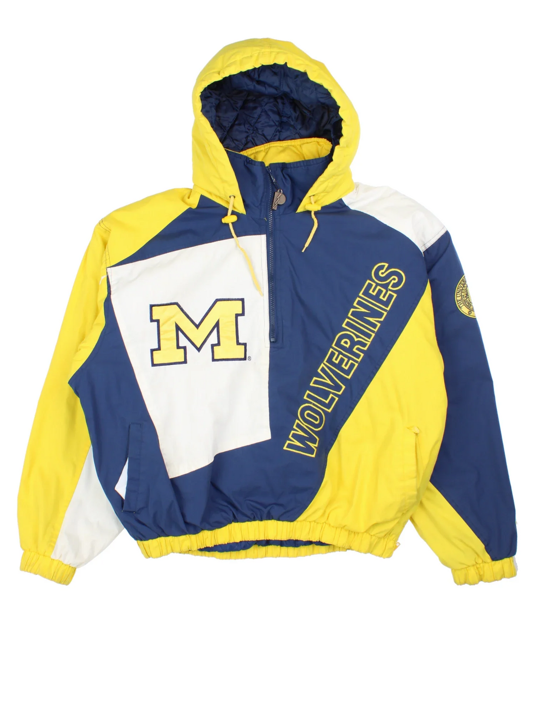 Michigan Wolverines Pro Player College Jacket in a blue colourway with yellow and white panelling. Full zip up, drawstring hood and team logo on the front. Larger text logo across the back.