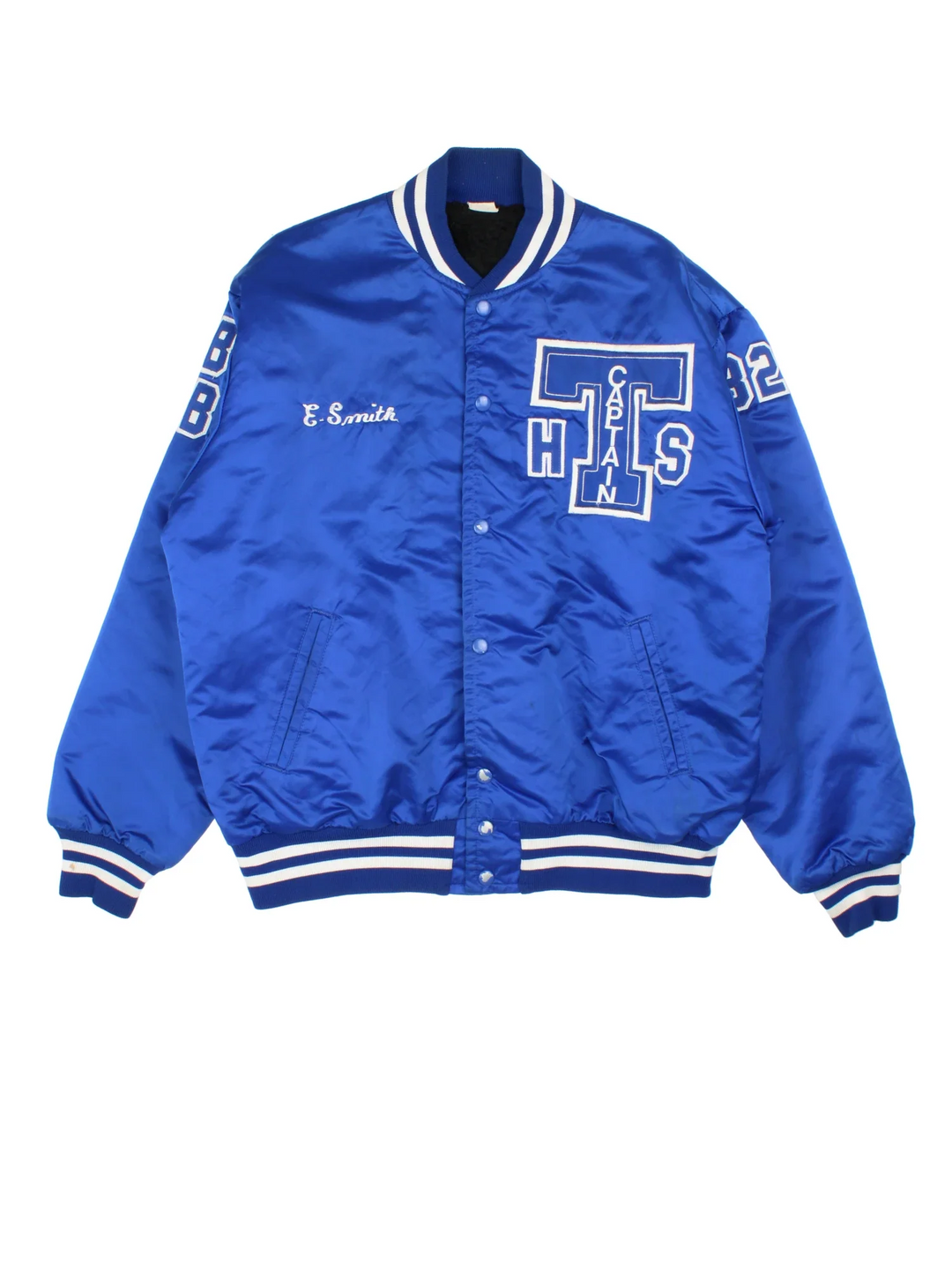 Vintage College Sports Varsity Jacket in a blue colourway with white detailing. Full button up, team logo on the front and larger graphic logo across the back.