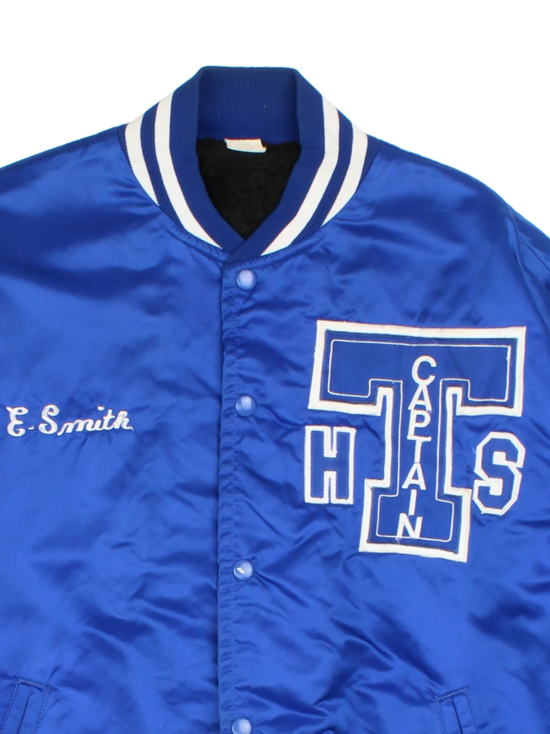 Vintage College Sports Varsity Jacket in a blue colourway with white detailing. Full button up, team logo on the front and larger graphic logo across the back.
