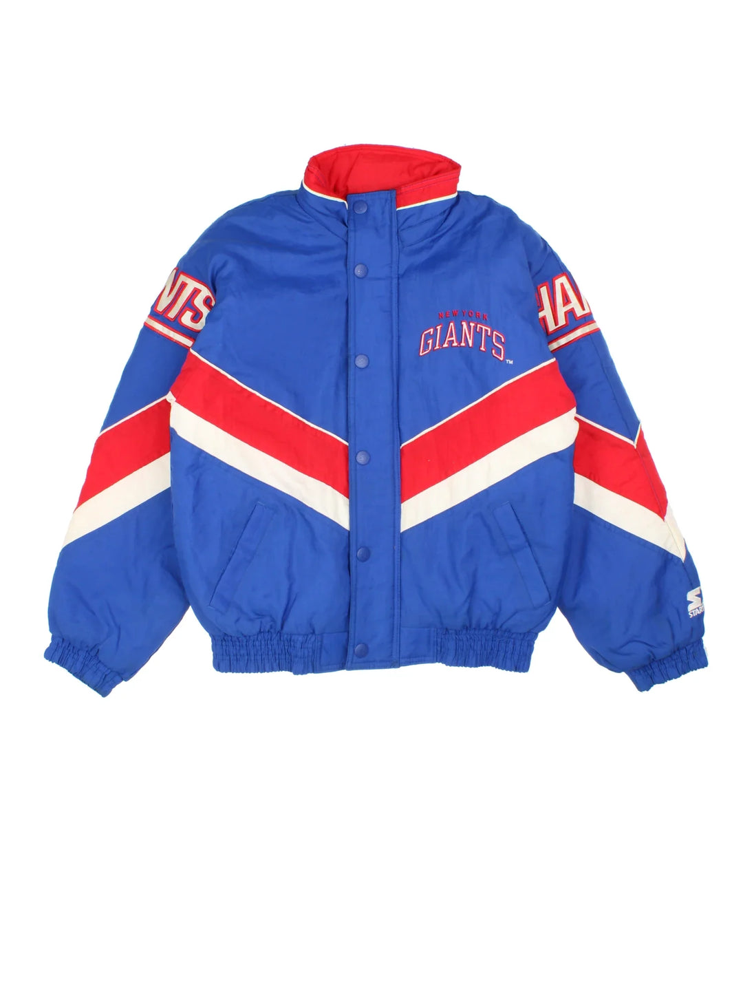 New York Giants Starter NFL Jacket in a blue colourway with red and white panelling. Full zip and button up front, multiple pockets, small logo on the front and across the back.