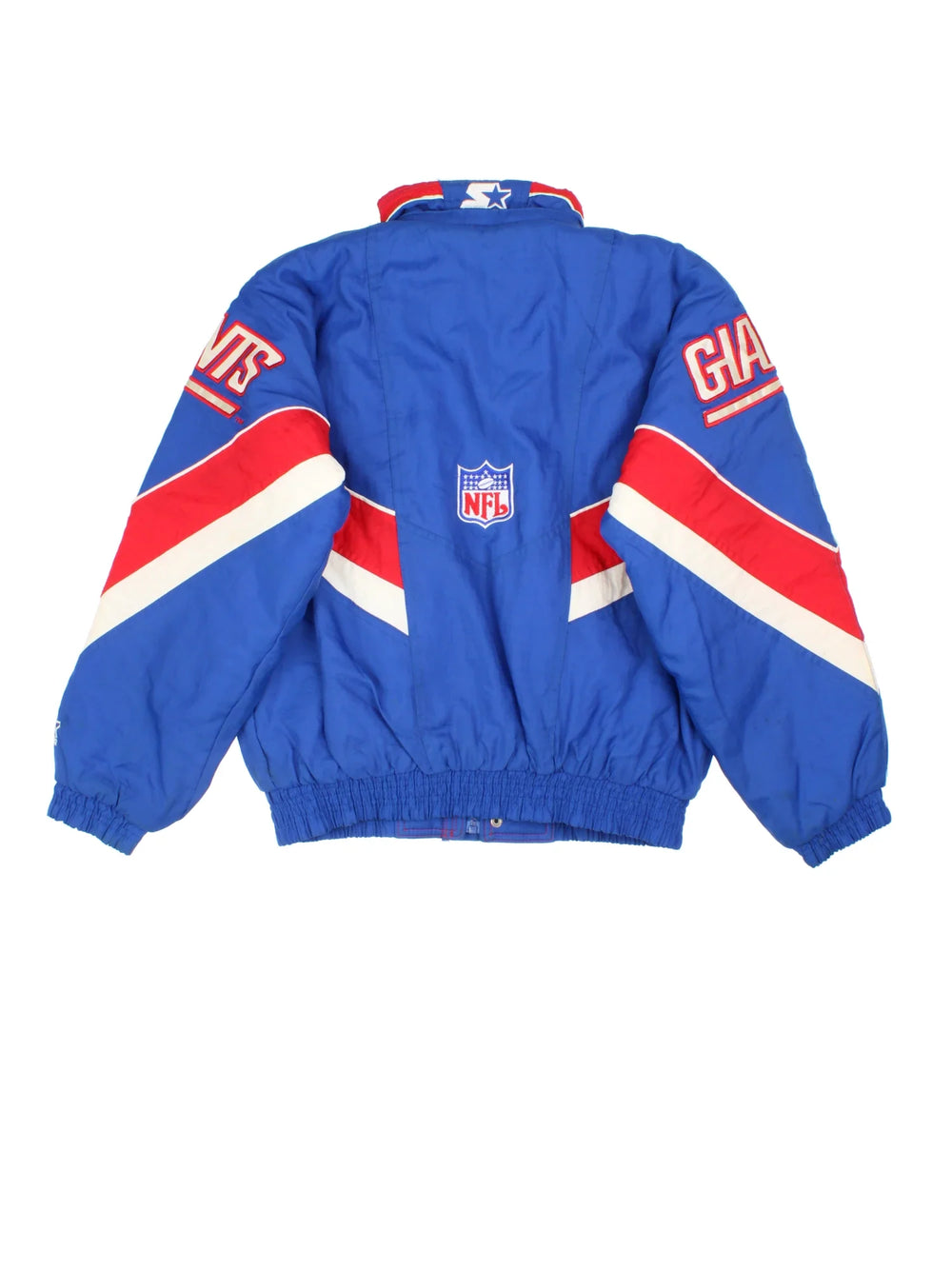 New York Giants Starter NFL Jacket in a blue colourway with red and white panelling. Full zip and button up front, multiple pockets, small logo on the front and across the back.