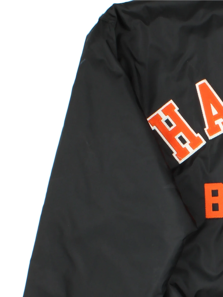 Vintage Harlem Bowling Team Varsity Jacket in a black colourway with orange detailing. Full button up front, multiple pockets and small logo on the front. Large team logo across the back.