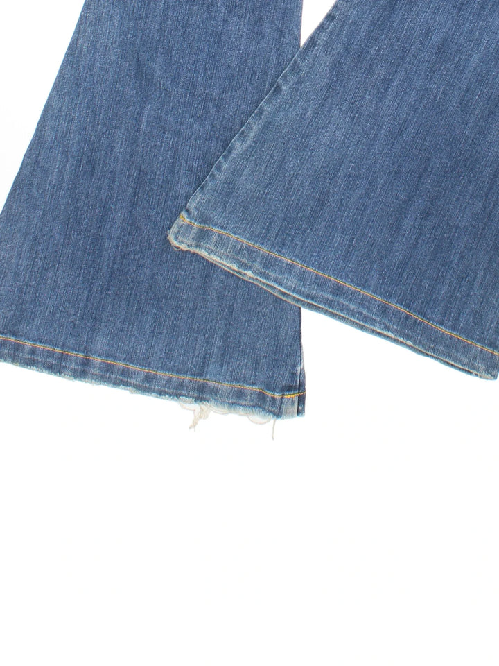 Y2K Flared Jeans in blue colourway with multiple pockets and embroidered braning on the front/back.