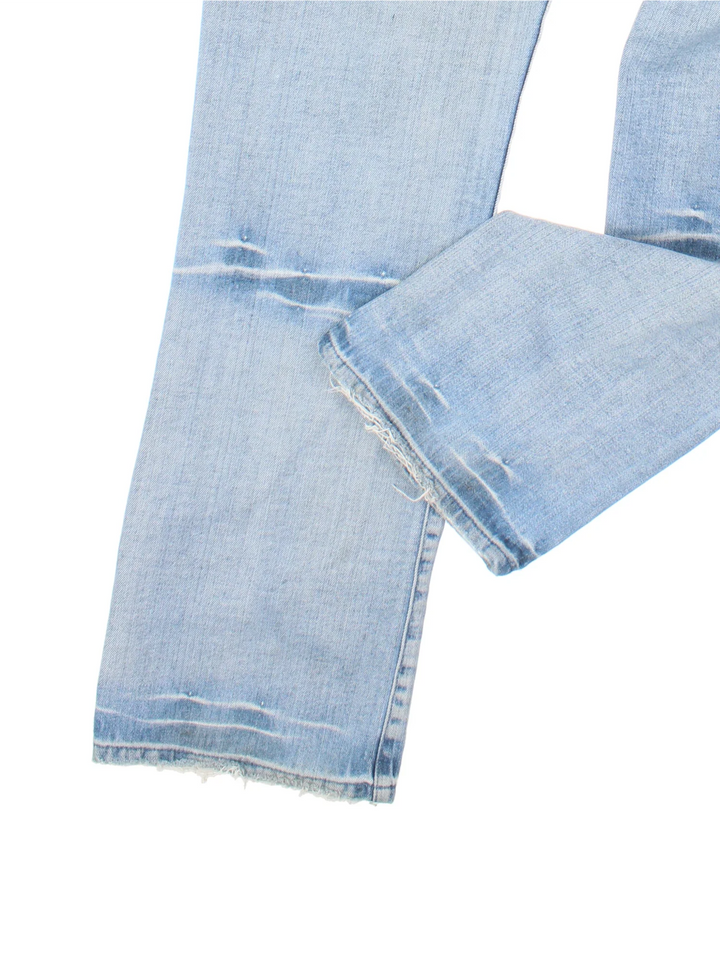 Y2K Guess Jeans in blue colourway with multiple pockets and embroidered branding/detail on the back.