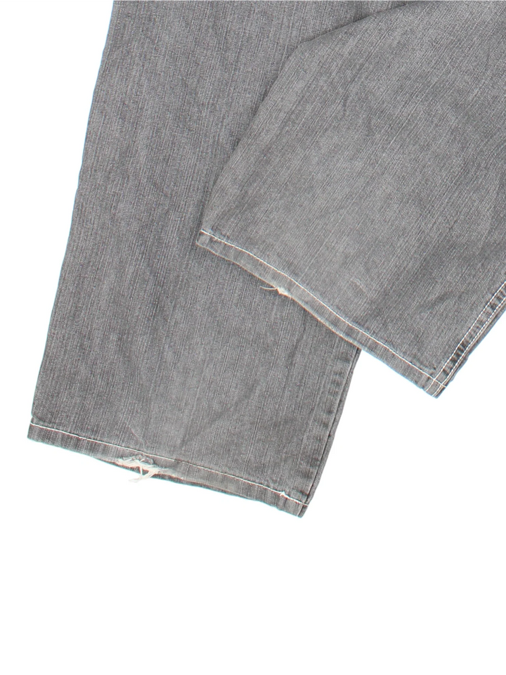 Y2K Happy Hope Jeans in grey colourway with multiple pockets, contrast stitching and embroidered branding on the back.