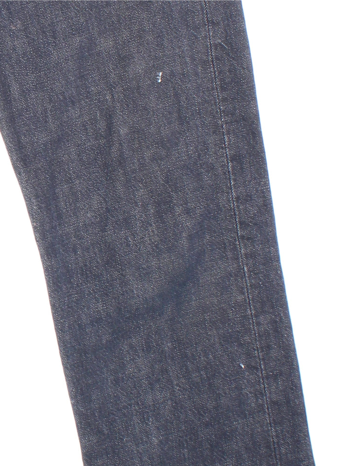 Levi Strauss 501 Jeans in faded blue colourway with multiple pockets and the logo tab embroidered on the back.