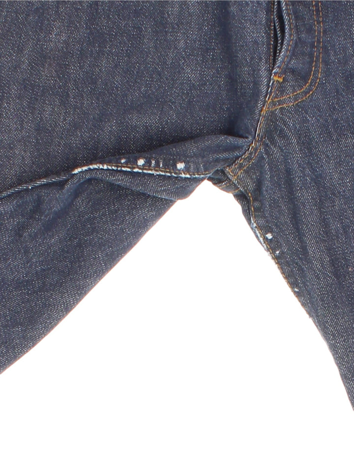 Levi Strauss 501 Jeans in faded blue colourway with multiple pockets and the logo tab embroidered on the back.