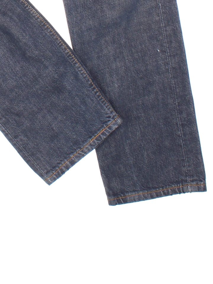 Levi Strauss 501 Jeans in faded blue colourway with multiple pockets and the logo tab embroidered on the back.