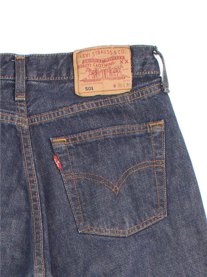 Levi Strauss 501 Jeans in faded blue colourway with multiple pockets and the logo tab embroidered on the back.