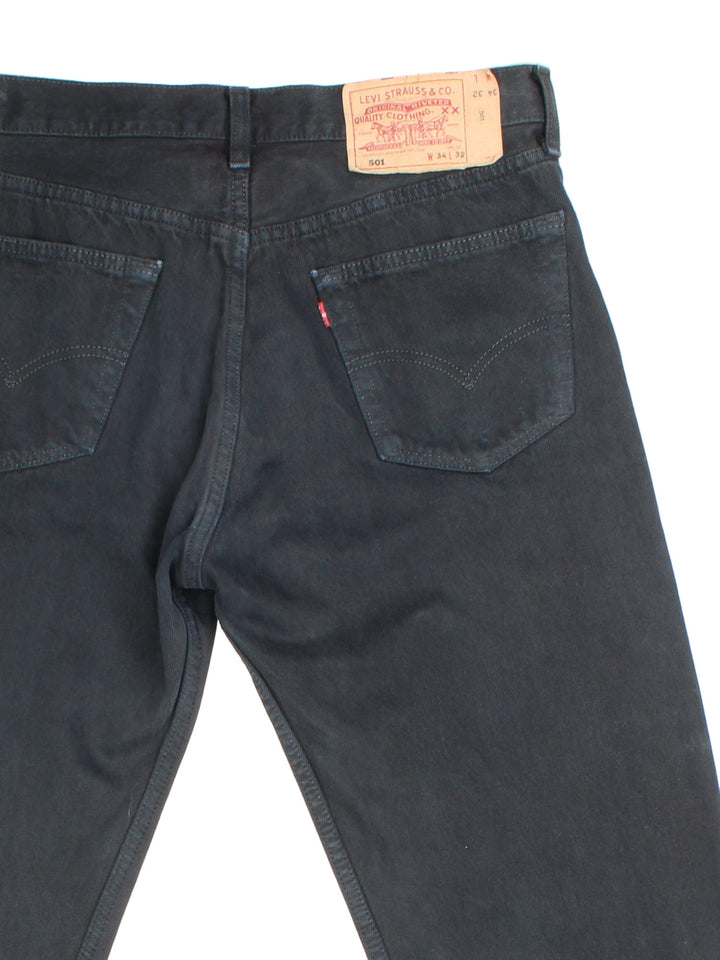 Levi Strauss 501 Jeans in black colourway with multiple pockets and the logo tab embroidered on the back.