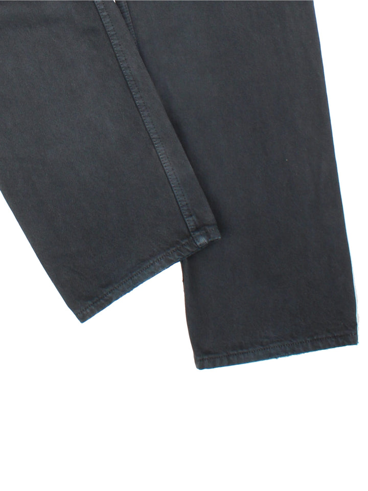 Levi Strauss 501 Jeans in black colourway with multiple pockets and the logo tab embroidered on the back.