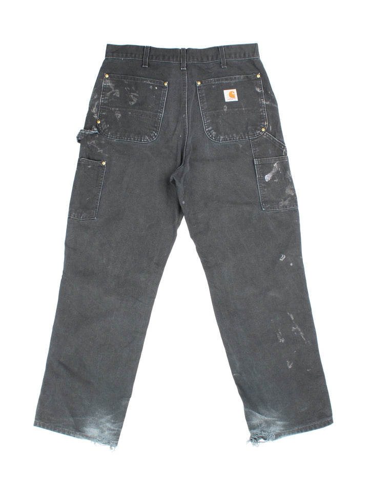 Carhartt Double Knee jeans in black colourway with multiple pockets and embroidered logo on back.