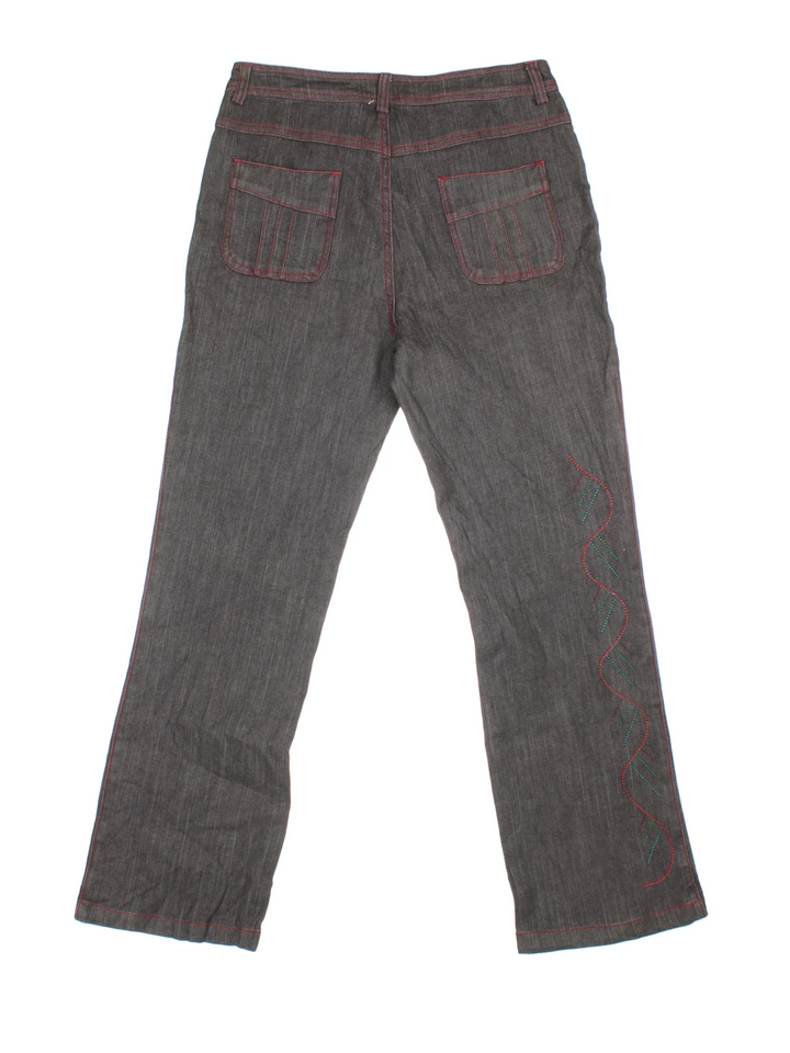 Vintage Y2K Embroidered Flared Jeans in black colourway. Multiple pockets and embroidered detail on the front/back.