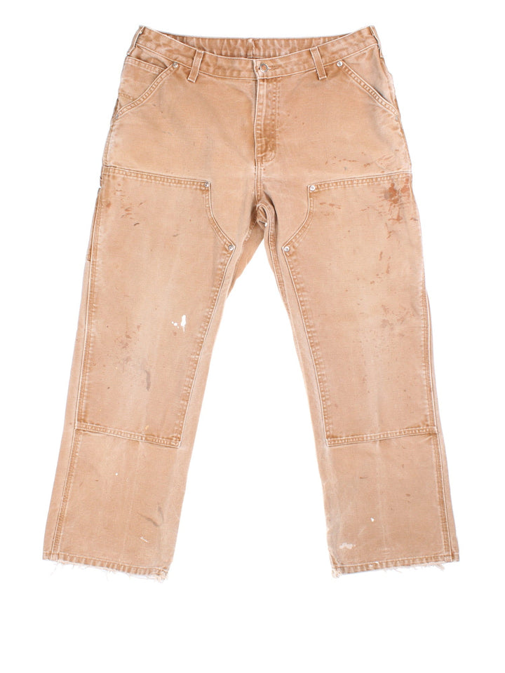 Carhartt Double Knee Jeans in tan colourway with multiple pockets and the logo embroidered on the back.