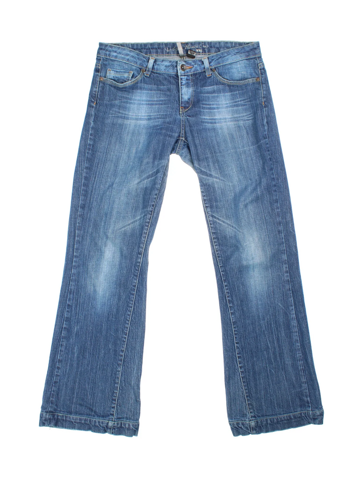 Y2K Flared Jeans in blue colourway, with multiple pockets, contrast stitching and embroidered branding on the back.