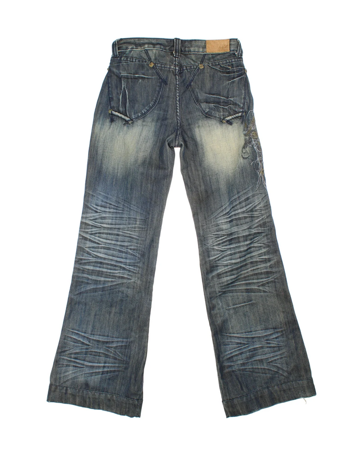 Y2K Embroidered Flared Jeans in blue colourway, with multiple pockets and metalic embroidered detail on the front/back.