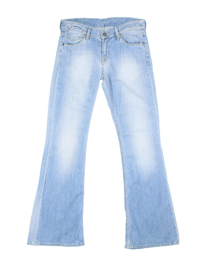 Y2K Jeans in blue colourway with multiple pockets and the logo embroidered on the back.