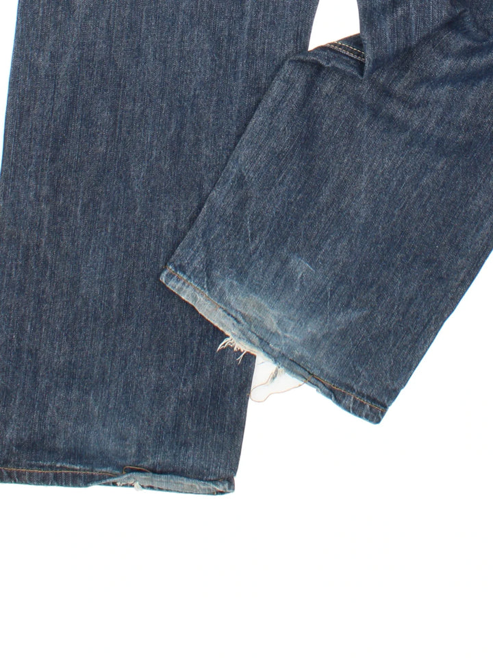 Vintage Y2K Avirex Jeans in blue colourway with multiple pockets and leather detailing on the back.