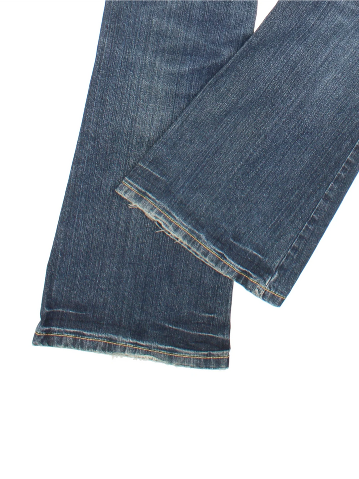 Y2K Espirit Low Rise Flared Jeans in blue colourway with multiple pockets and contrast stitching.