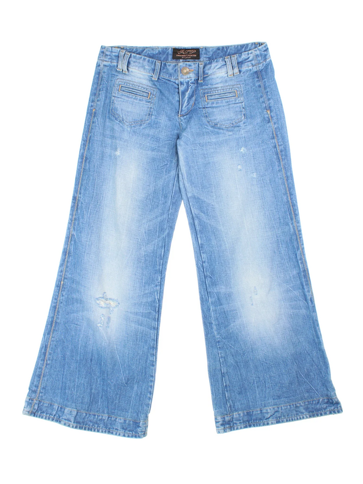 Y2K Low Rise Jeans in blue colourway with multiple pockets, contrast stitching and branding embroidered on the back.