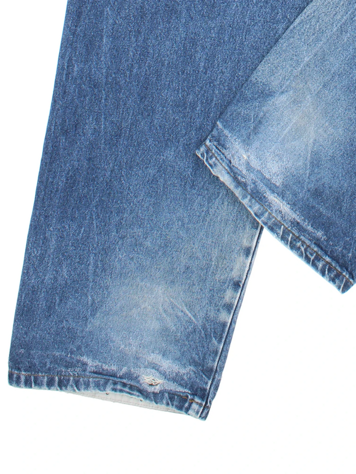 Vintage 90's 2Pac Baggy Jeans in blue colourway with multiple pockets, contrast stitching and embroidered branding on back.